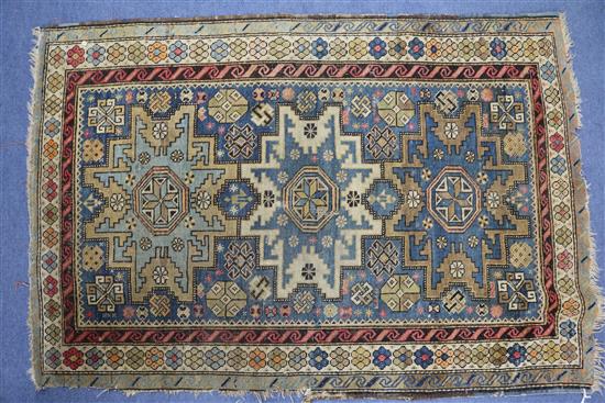 A Caucasian blue ground rug 135 x 90cm